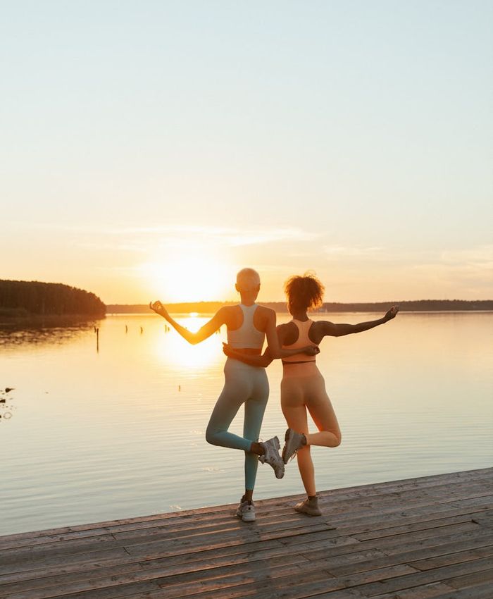 A beautiful, serene sunrise over a calm lake, reflecting energy and a fresh start.